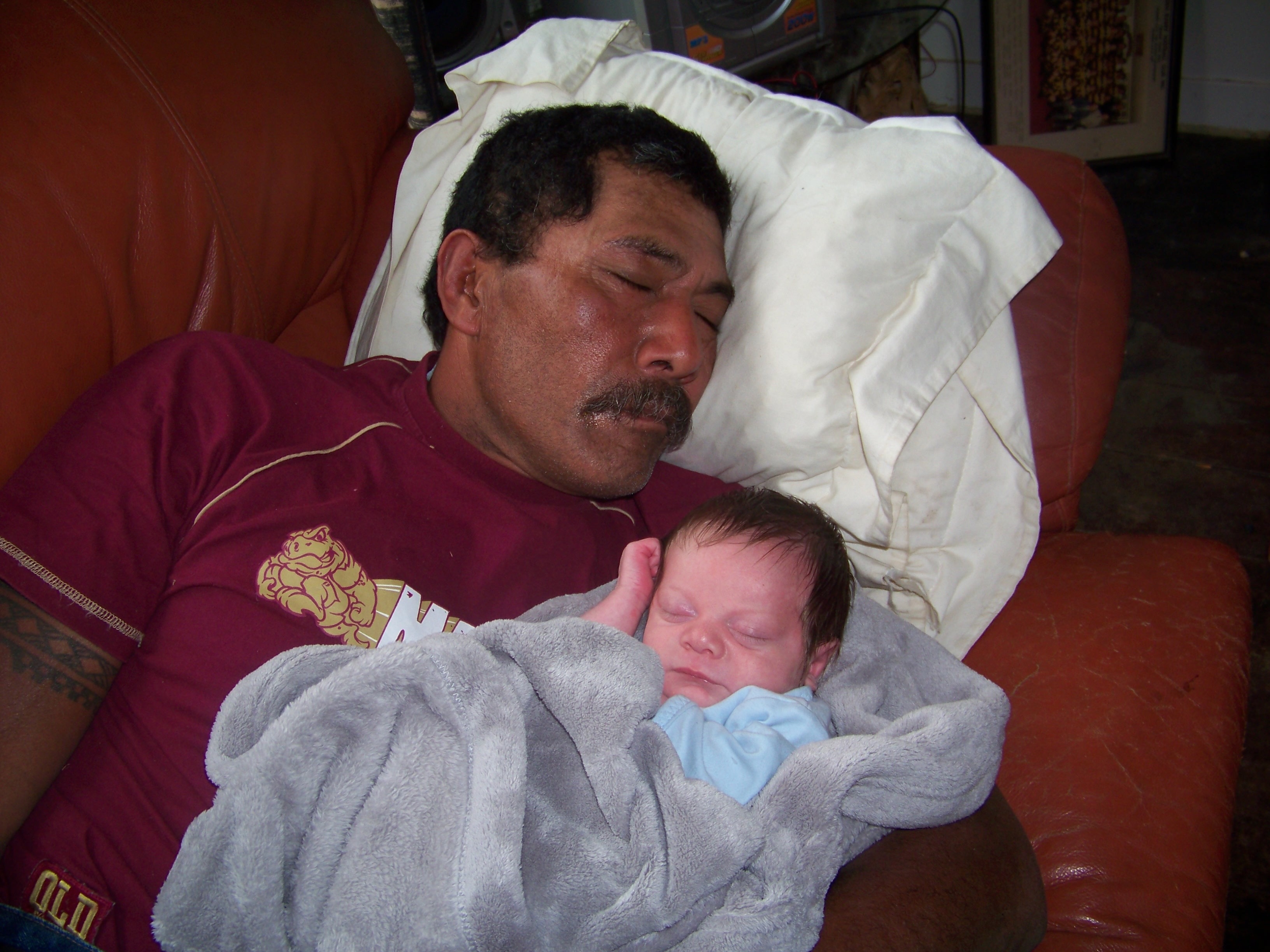 Tai as a baby with his Papa